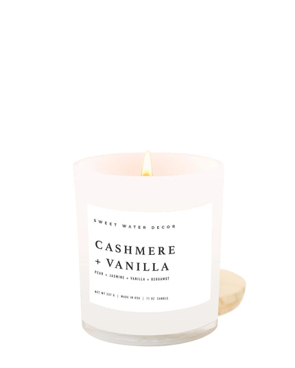 Candle with 'Cashmere + Vanilla' fragrance on a white background