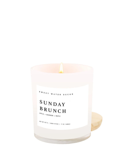 Candle with 'Sunday Brunch' label on a white background