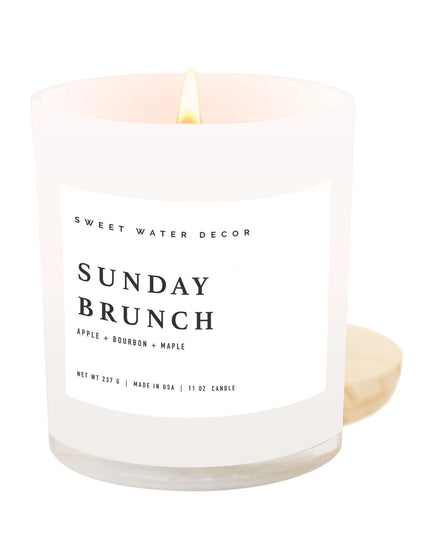 Candle with 'Sweet Water Decor' branding and 'Sunday Brunch' scent on a white background