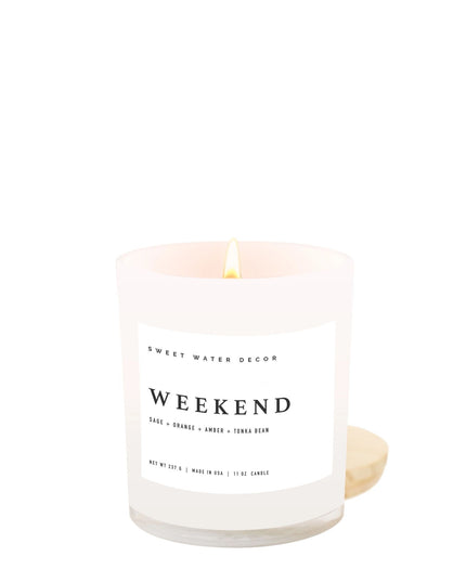 Candle with 'Sweet Water Decor' branding and 'Weekend' scent on a white background