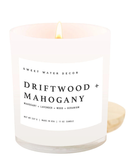 Candle with 'Driftwood Mahogany' label on a white background