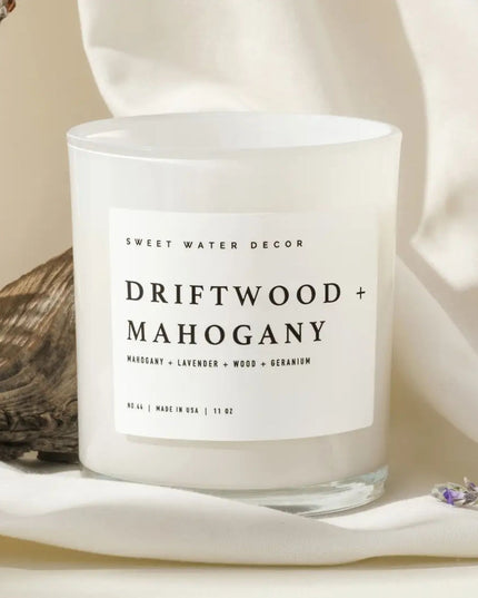 Candle with 'Sweet Water Decor' label on a neutral background