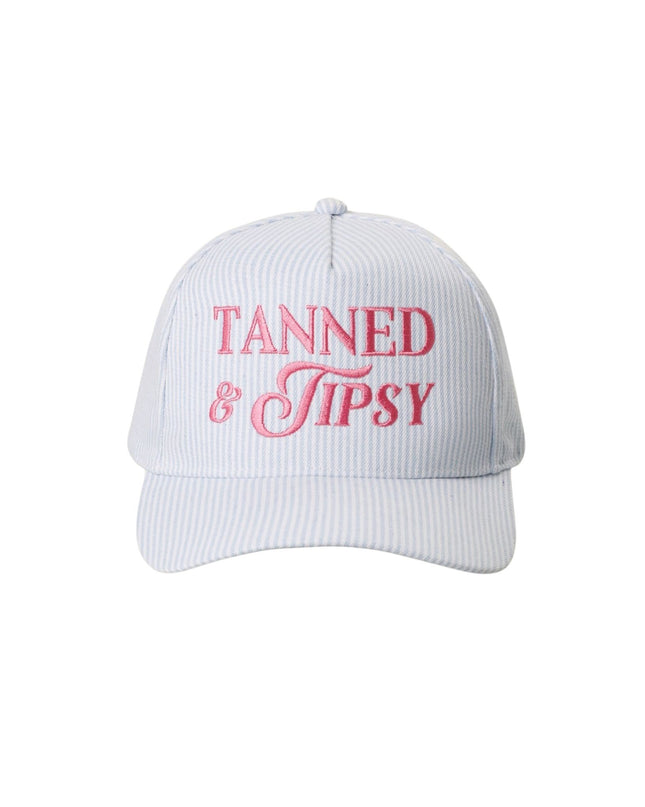 White cap with red text 'Tanned & Tipsy' on a white background