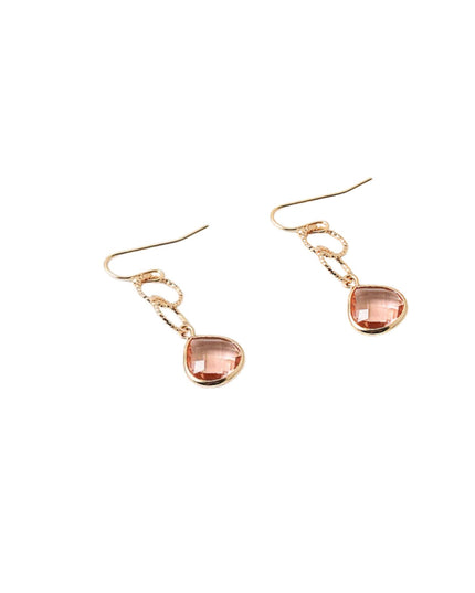 A pair of rose gold drop earrings featuring teardrop-shaped faceted pink gemstones, displayed on a clean white background.