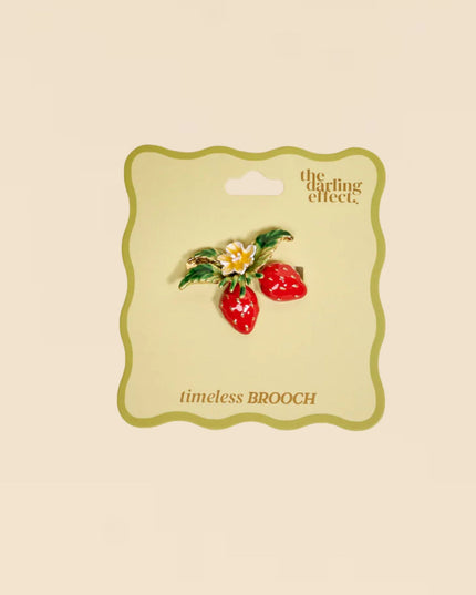 Brooch on a 'the darling effect' card with a beige background