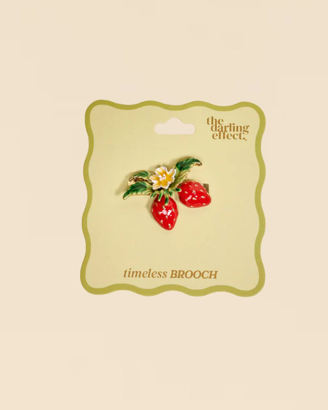 Brooch on a 'the darling effect' card with a beige background
