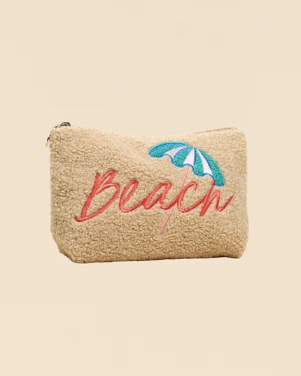 Beige pouch with 'Beach' and an umbrella design on a beige background