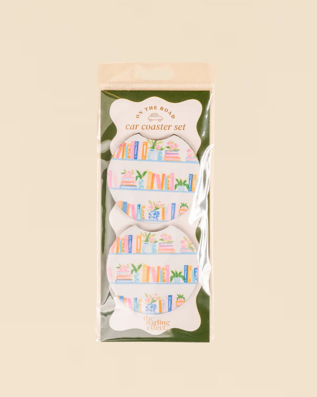 Packaged set of car coasters with colorful designs on a beige background