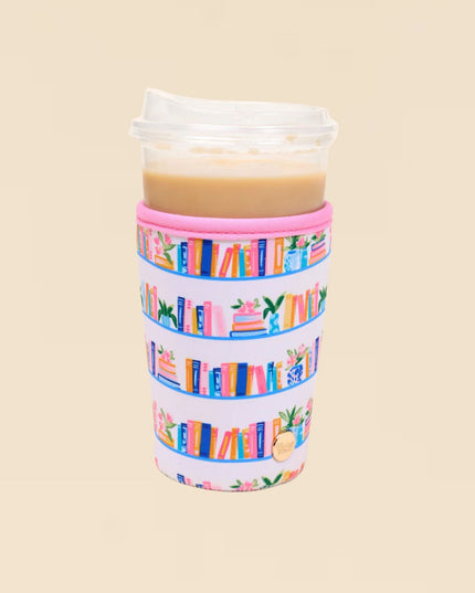 Tumbler with colorful book pattern on a beige background