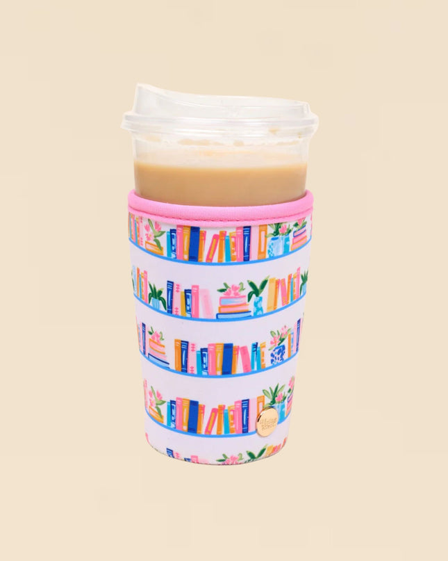 Tumbler with colorful book pattern on a beige background