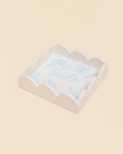Decorative pillow with 'Bride' text on a beige background
