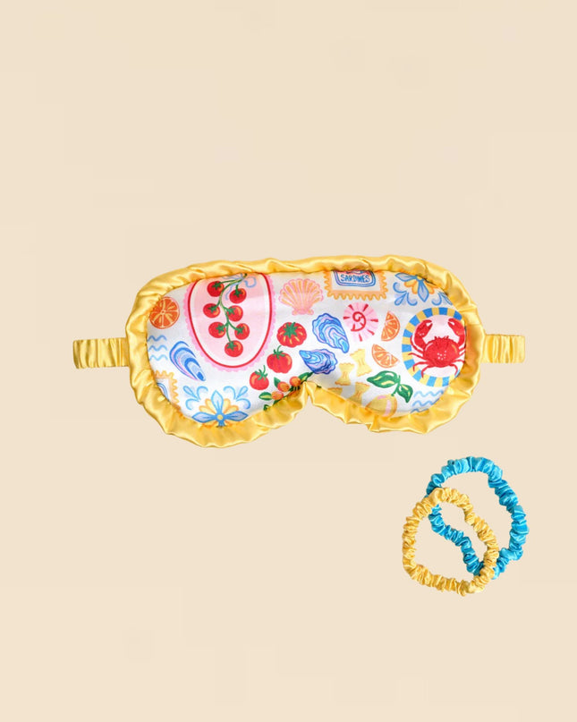 Decorative eye mask with colorful patterns on a beige background