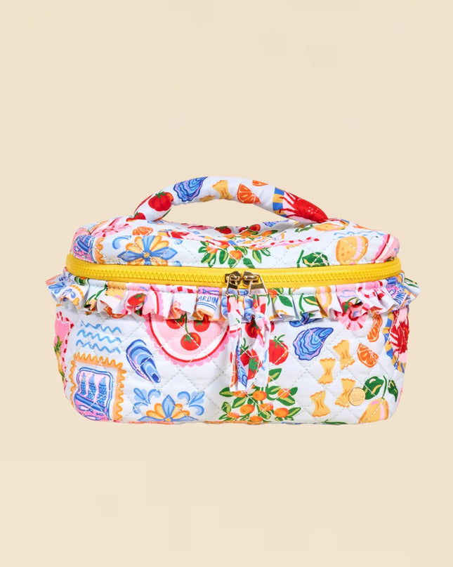 Colorful patterned lunch bag with a yellow zipper on a beige background