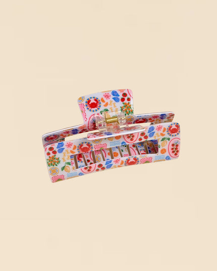 Colorful floral-patterned product packaging on a beige background