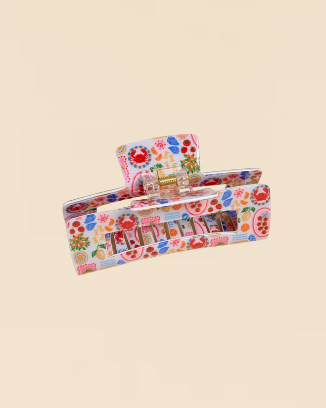 Colorful floral-patterned product packaging on a beige background
