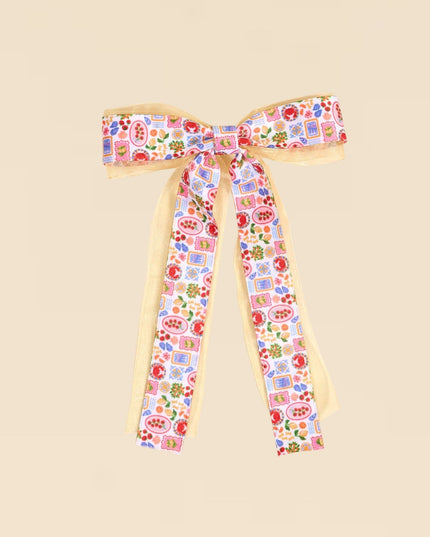 Floral headband with ribbons on a beige background