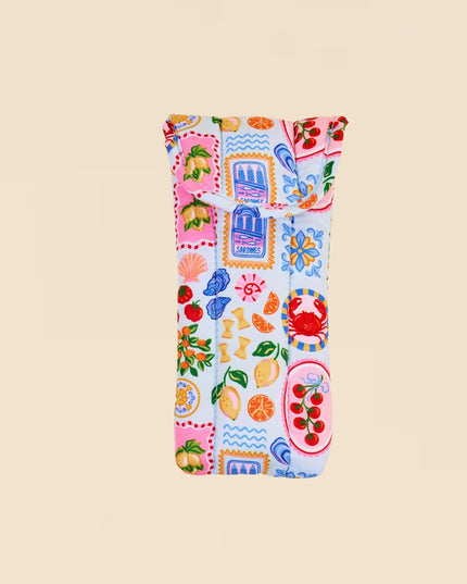 Colorful patterned fabric roll on a beige background