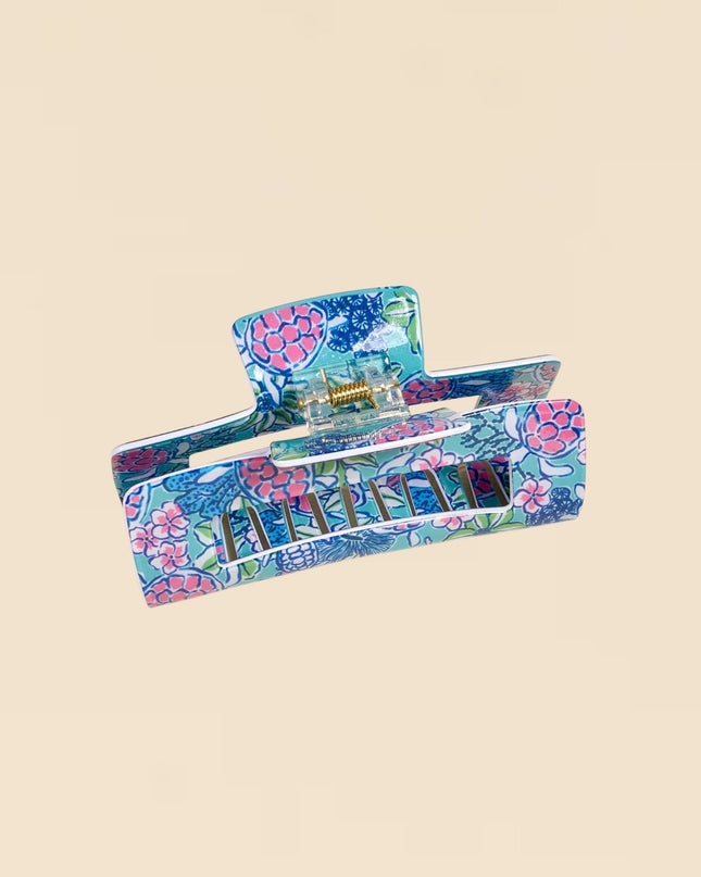 Colorful floral-patterned wallet on a beige background