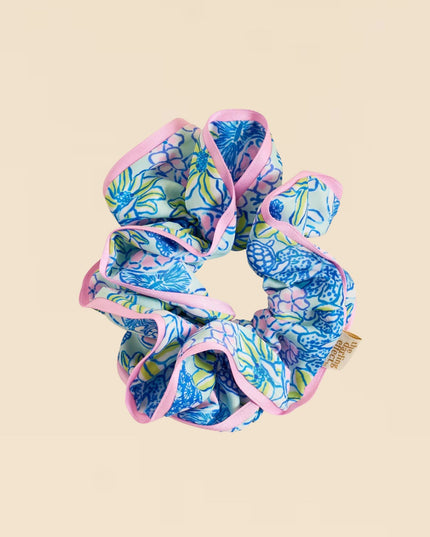 Blue and pink scrunchie on a beige background