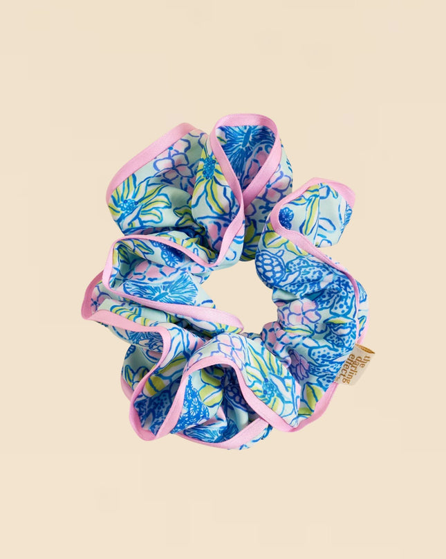 Blue and pink scrunchie on a beige background