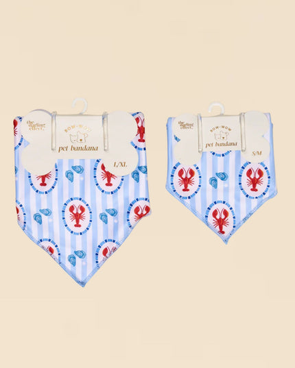 Two lobster-themed pet bandanas on beige background
