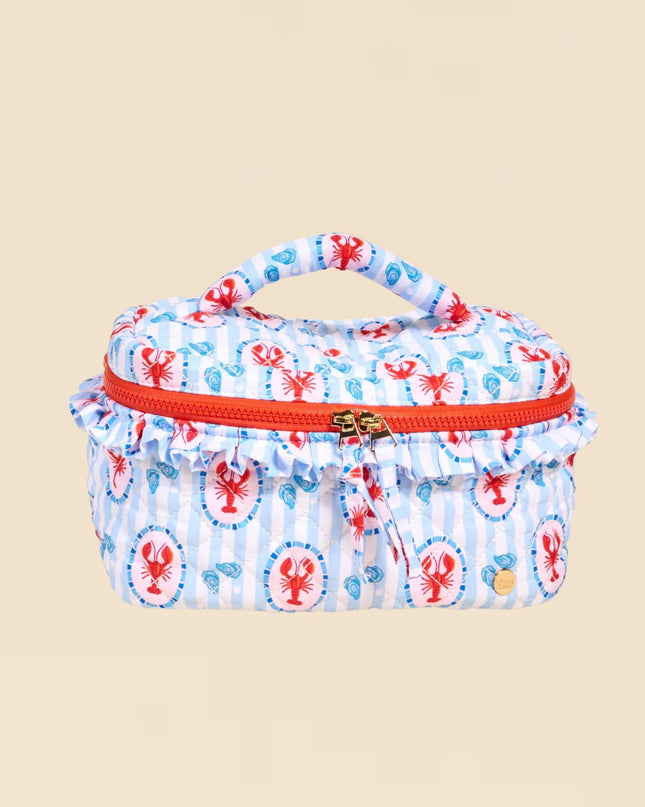Small oval-shaped bag with red zipper and lobster pattern on a beige background