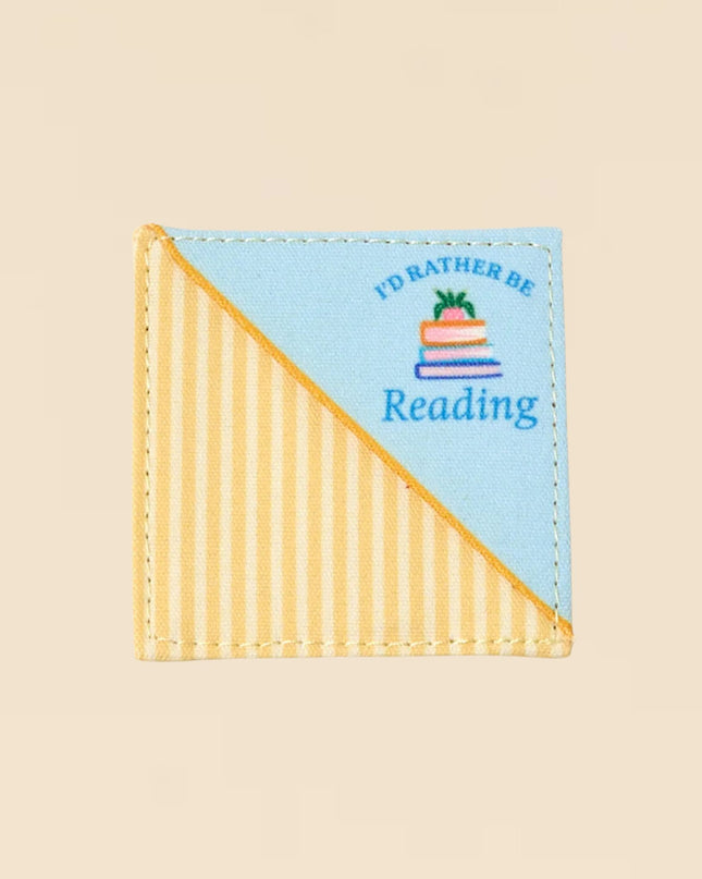 Small rectangular patch with 'I'd Rather Be Reading' text and book illustration on a beige background