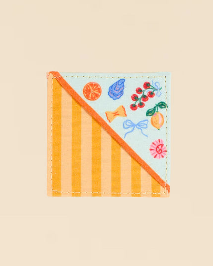 Colorful patch with striped design and cartoon-like illustrations on a beige background