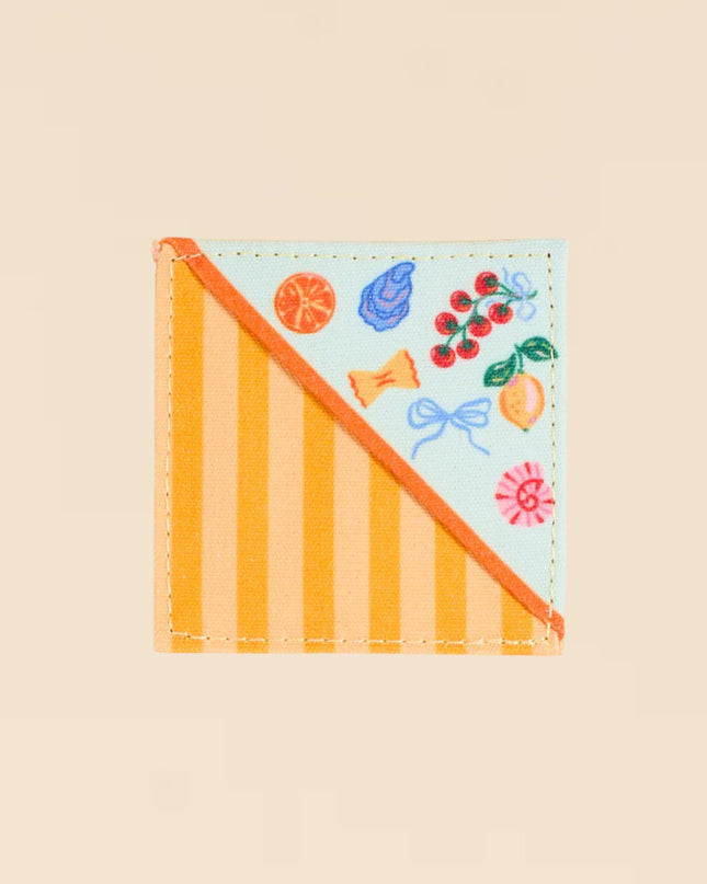 Colorful patch with striped design and cartoon-like illustrations on a beige background