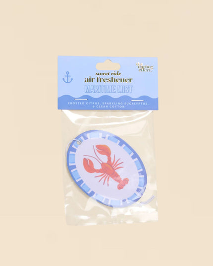 Air freshener with lobster design in clear packaging on a beige background