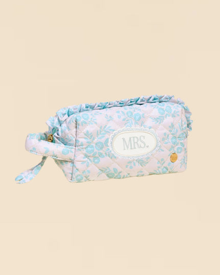 Floral patterned pouch with 'MRS.' embroidery on a beige background
