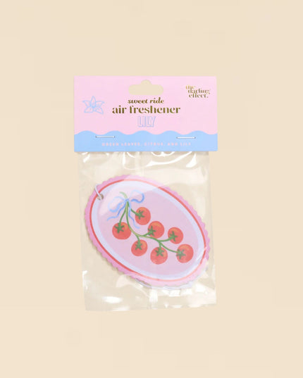Air freshener with cherry design on a beige background