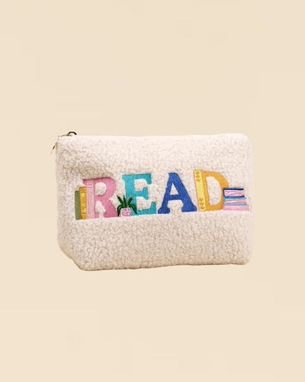 White textured pouch with colorful 'READ' text on a beige background