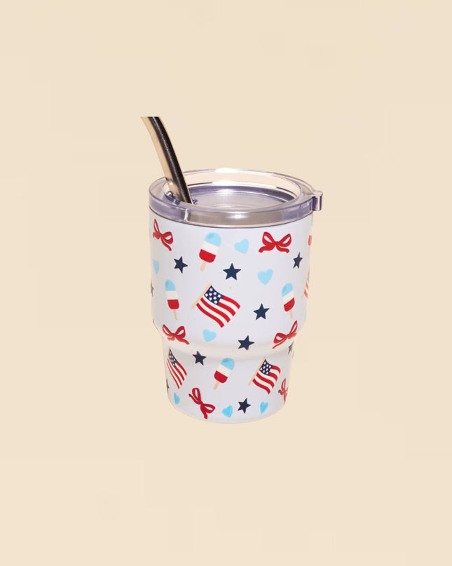 Tumbler with patriotic design on a beige background