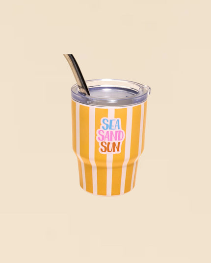 Tumbler with orange and white stripes and 'Sea Sand Sun' text on a beige background