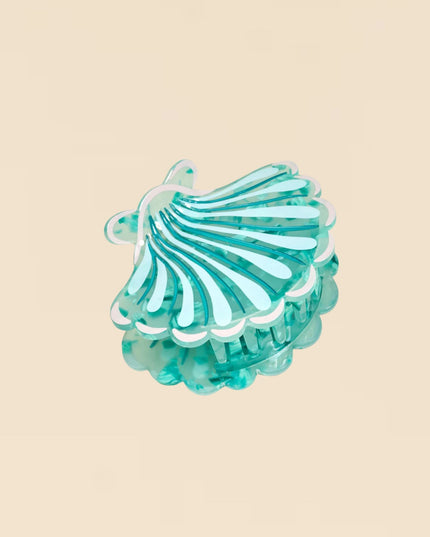 Turquoise hair clip on a beige background