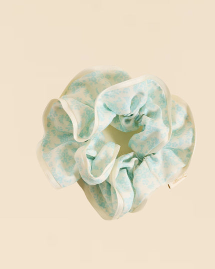 Floral patterned scrunchie on a beige background
