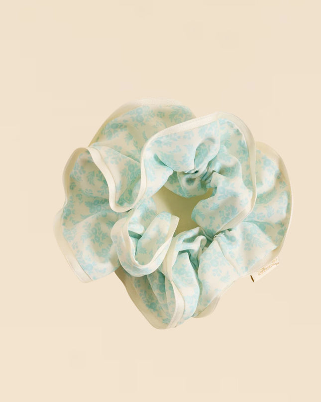 Floral patterned scrunchie on a beige background