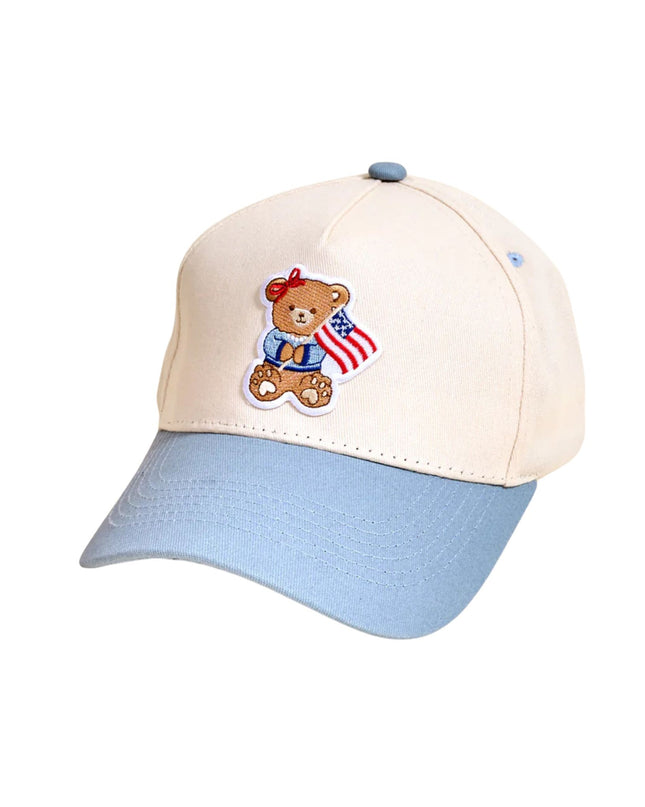 Cap with teddy bear emblem featuring an American flag on a white background