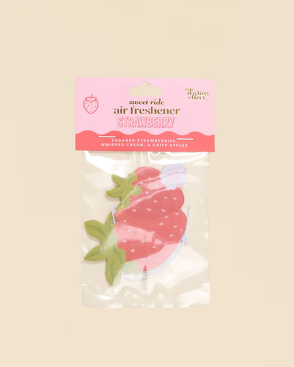Strawberry air freshener packaging on a beige background