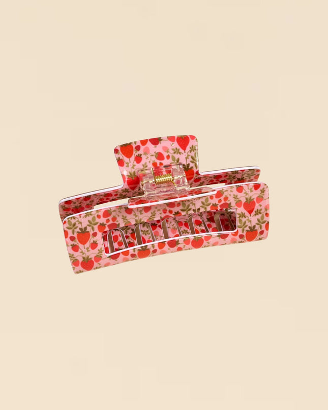 Floral-patterned pencil case on a beige background