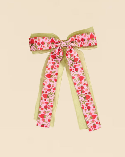 Floral ribbon bow on a beige background