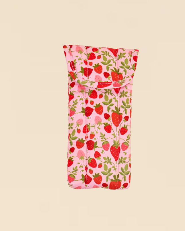 Pink pouch with strawberry pattern on a beige background