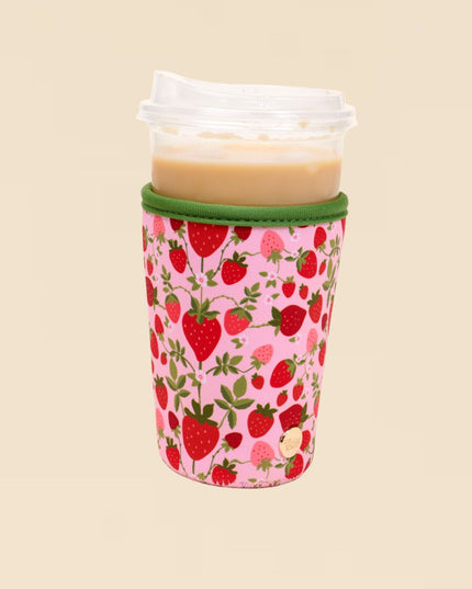 Tumbler with a strawberry pattern on a beige background