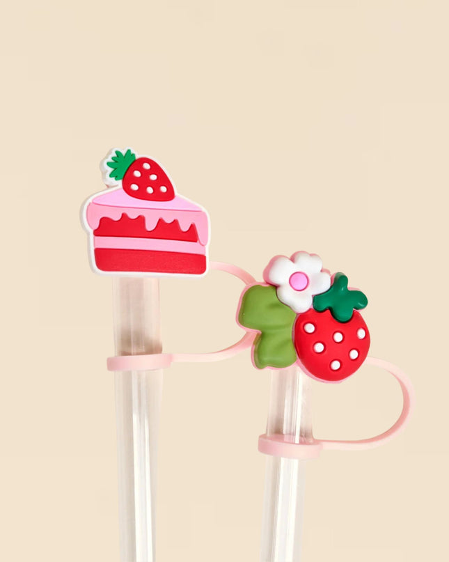 Strawberry-themed hair clips on a beige background