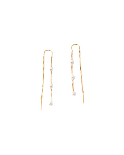 A pair of gold drop earrings with small white pearl beads, shown against a plain white background.