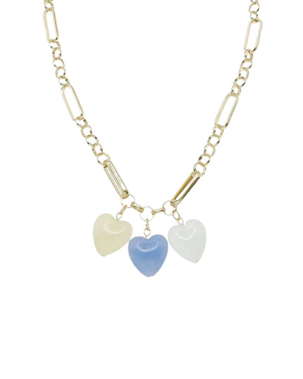 A gold Figaro chain necklace featuring three dangling heart charms in pale yellow, light blue, and light green, shown against a plain white background.
