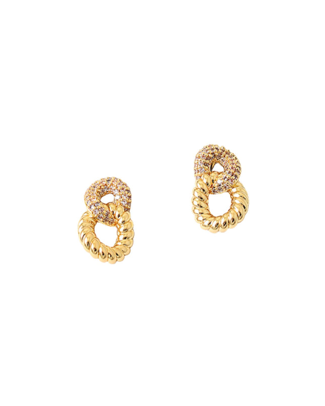 Pair of gold earrings on a white background