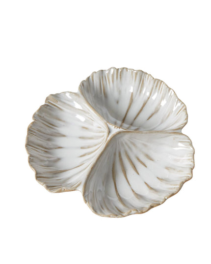 Decorative shell-shaped dish on a white background