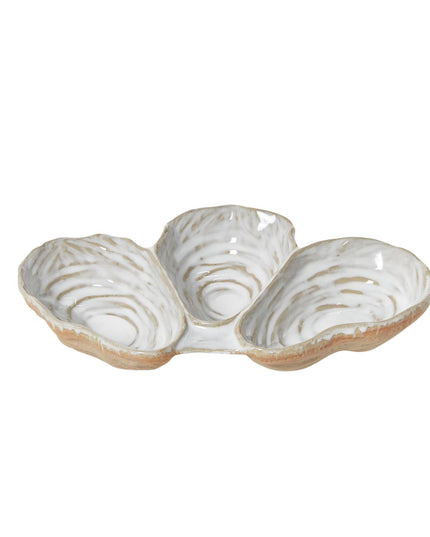 Three-section ceramic dish with a textured surface on a white background